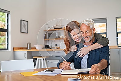 Loving woman embracing senior man Stock Photo