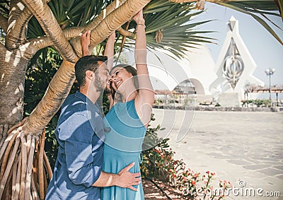 Loving young couple close to kiss outdoor - Romantic happy lovers having a cute story of love in vacation on their honeymoon Stock Photo