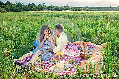 Loving young couple enjoying a date in the country. Stock Photo