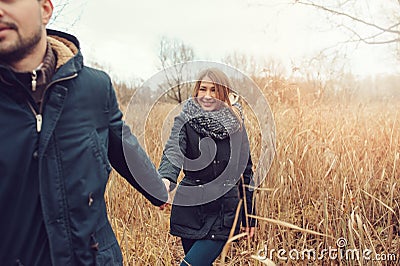 Loving young couple happy together outdoor on cozy warm walk in autumn forest Stock Photo