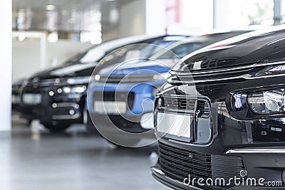 Low angle of extravagance store with cars in a row for sale Stock Photo