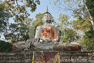 Low Angle Front Meditation Buddha Statue in Forest Editorial Stock Photo