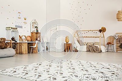 Low angle of a girl`s bedroom interior with a patterned rug, woo Stock Photo