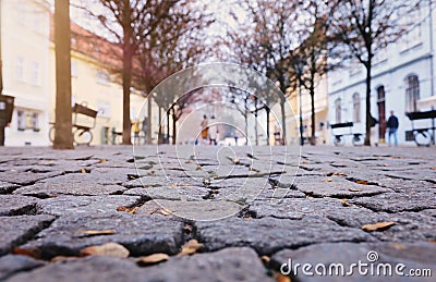 low angle of paving stone vintage road cover with old houses, antique street Stock Photo