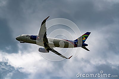 Low angle photo of a Spirit airplane in flight retracting landing gear position Editorial Stock Photo