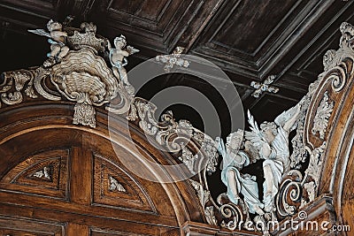 Low angle shot of angels statues on wood carvings - religion concept Stock Photo