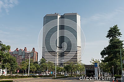 Low Angle Shot of The Bao-Cheng Enterprise Tower Against Blue Sky. Editorial Stock Photo