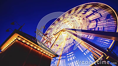 Low angle shot of a Ferris wheel on Chicago Navy Pier during the evening time Editorial Stock Photo