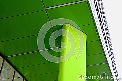Low Angle Shot of a green sustaining pillar of the building facade Stock Photo