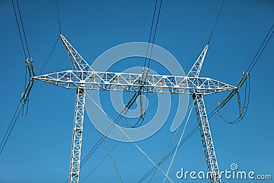 Low angle shot of overhead high-voltage power lines Stock Photo