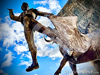 Low-angle shot of a statue of a matador with a bull. The plaza de toros de Las Ventas. Editorial Stock Photo