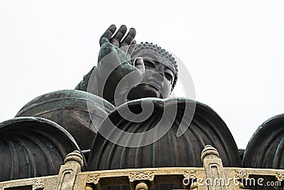 Low angle shot of the statue of Tian Tan Buddha in Lantau Hong Kong under a clear sky Stock Photo