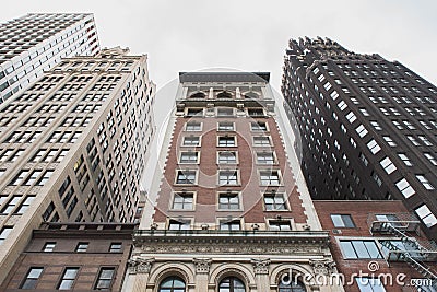 Low angle shot of tall brown buildings in New York City Stock Photo