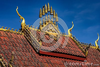 Low-angle shot of a temple roof design in Wat Phiawat, Xiangkhouang, Laos Stock Photo