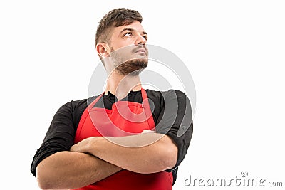 Low angle supermarket employer standing with arms crossed Stock Photo