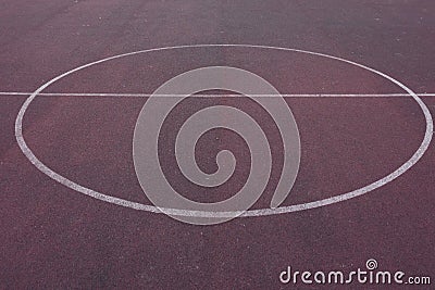 Low angle telephoto perspective of fifty yard line center field of professional or high school football artificial turf field pain Stock Photo