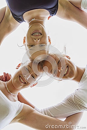 Low angle view of attractive positive girls standing together Stock Photo