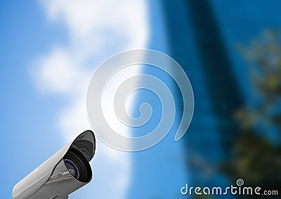 Low angle view of CCTV camera against defocused building Stock Photo