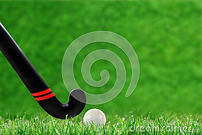 Field Hockey Stick and Ball on Grass With Copy Space Stock Photo