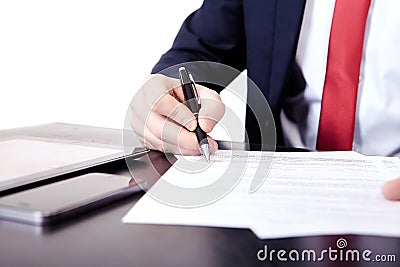 Low angle view of the fingers of a man writing on a document with a fountain pen conceptual of communication Stock Photo