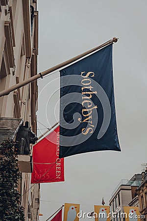 Low angle view of the flag outside Sotheby`s auction house on New Bond Street in London, UK Editorial Stock Photo
