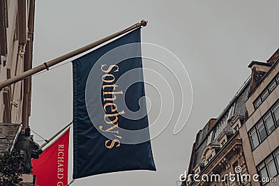 Low angle view of the flag outside Sotheby`s auction house on New Bond Street in London, UK Editorial Stock Photo