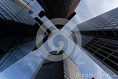 low angle view of four skyscrapers with different facade designs under the blue sky Stock Photo