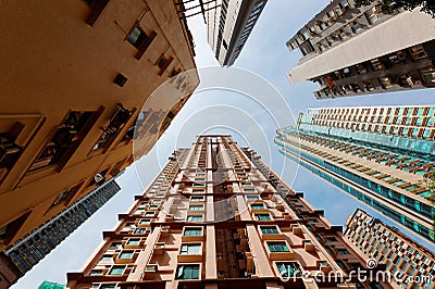 Low angle view of high-rise residential towers with crowded narrow apartments Stock Photo