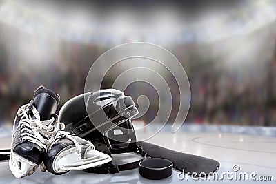 Ice Hockey Helmet, Skates, Stick and Puck in Rink Stock Photo