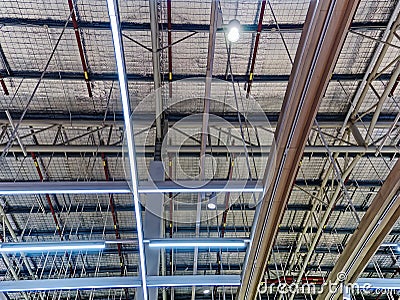 Low Angle View of Illuminated Warehouse Ceiling Stock Photo