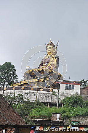 Low angle view of massive statue of Padmasambhava Guru Rinpoche in Rewalsar lake Tso Pema, Himachal Pradesh, India Stock Photo