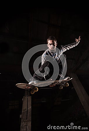 Low angle view of ollie with backside grab trick Stock Photo