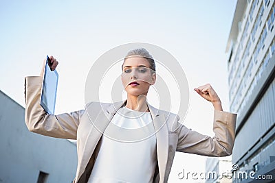 Low angle view of serious classy businesswoman making victory ge Stock Photo