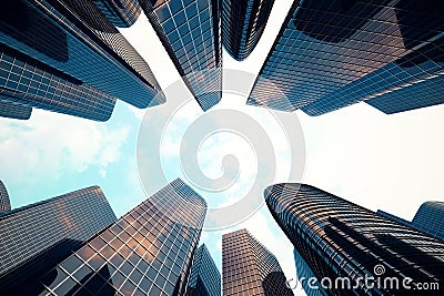 Low angle view of skyscrapers. Skyscrapers at sunset looking up perspective. Bottom view of modern skyscrapers in Stock Photo