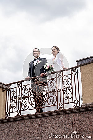 Low angle view of smiling newlyweds Stock Photo