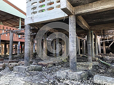 Low angle view of stilt houses at seashore Stock Photo