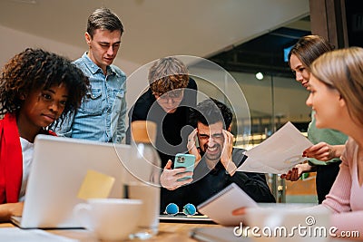 Low-angle view of stressed overwhelmed businessman feeling tired at corporate meeting. Portrait of exhausted male team Stock Photo