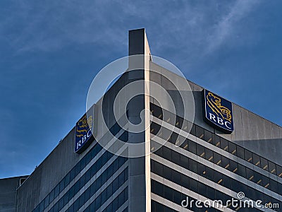 Low angle view of tall skyscraper with offices in Vancouver with logo of Royal Bank of Canada (RBC) on top. Editorial Stock Photo