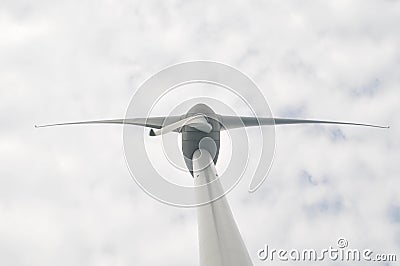 Low angle view of wind turbine against cloudy sky Stock Photo