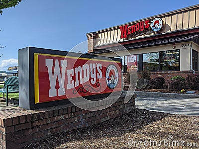 Low angle of a Wendy`s fast food restaurant on a sunny day Editorial Stock Photo