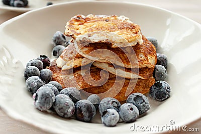 Low Carb Keto Diet Pancakes from almond coconut flour with blueberries on white plate Stock Photo