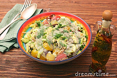 Low carbs Tuna Avocado Salad in glass bowl. Stock Photo