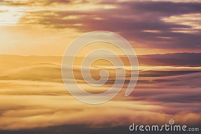 Low clouds covering mountain ridge. Stock Photo