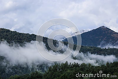 Low clouds on mountains Stock Photo