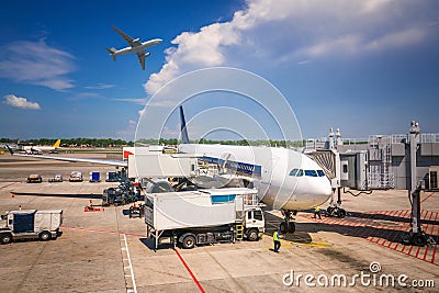 Low cost airline and small airplane loading Editorial Stock Photo