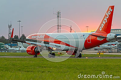 Low cost airlines Easy Jet plane landing at London Luton airport Editorial Stock Photo