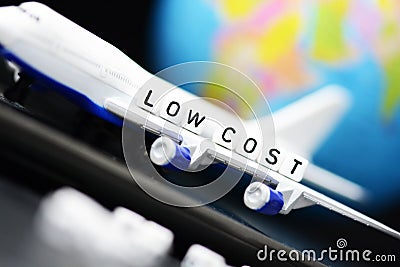 Low cost fly tickets concept with airplane close up and Earth globe in background Stock Photo