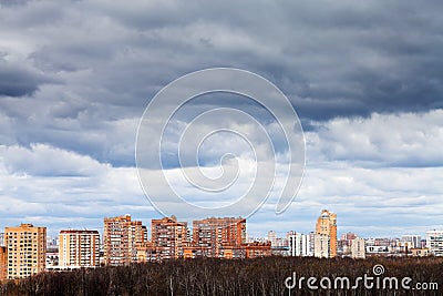 Low grey rainy clouds under city Stock Photo