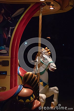 Low key closeup of a horse of a merry-go-round, with light and s Stock Photo