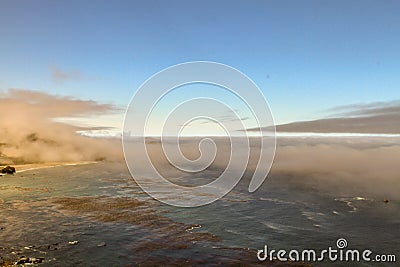 Low lying clouds over submerged coastal islands Stock Photo